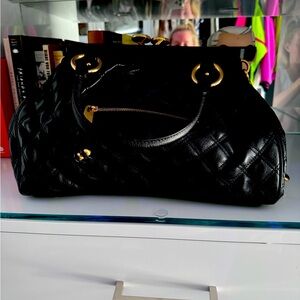 an original quilted stam bag- this is NOT from the re edition collection.
